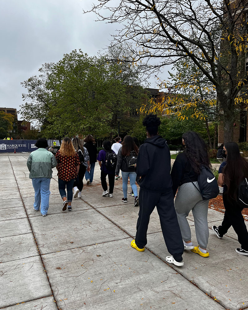 Green Bay West High School students walking around Marquette Campus during spring tour.