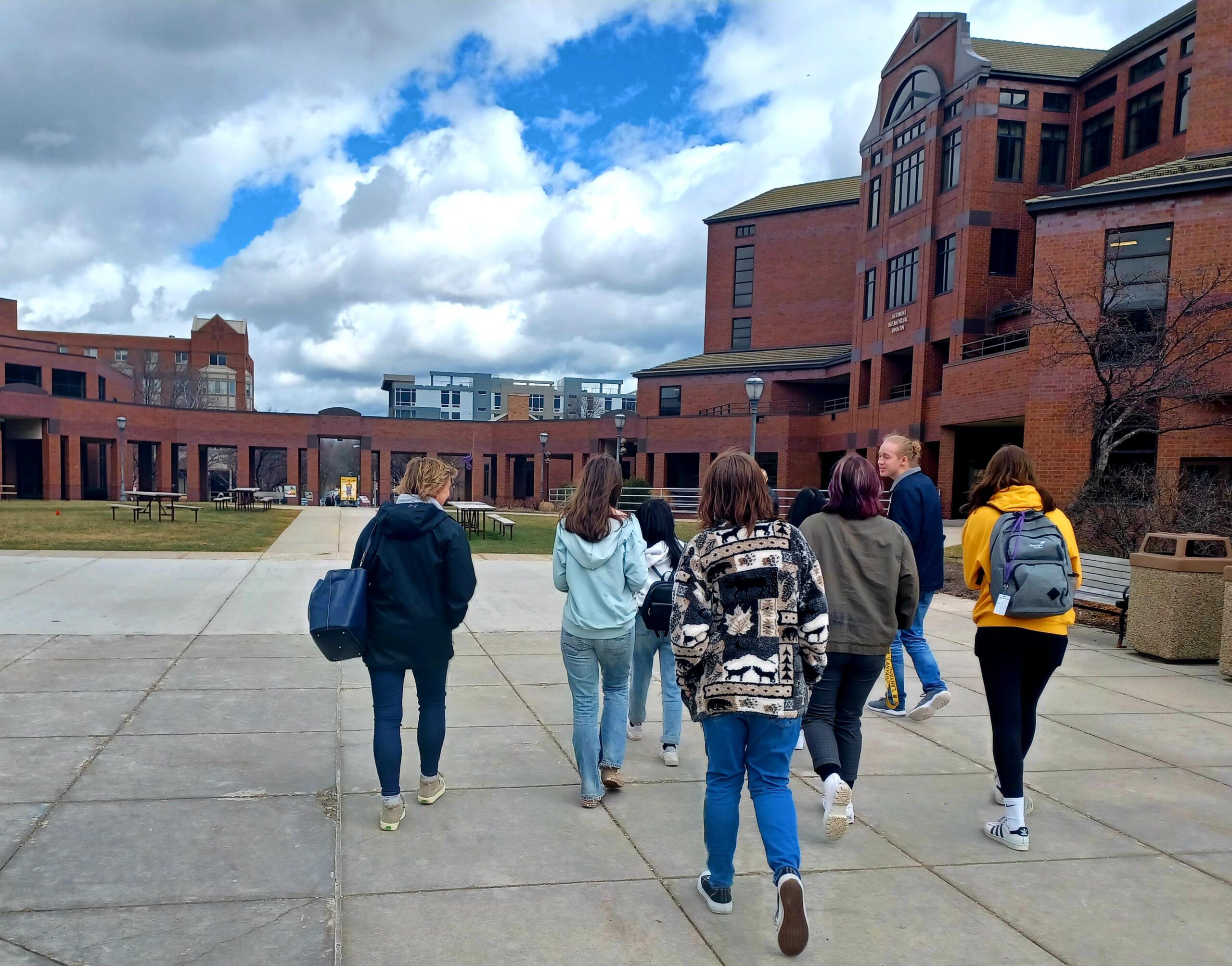 Green Bay West High School students walking around Marquette campus during spring tour.