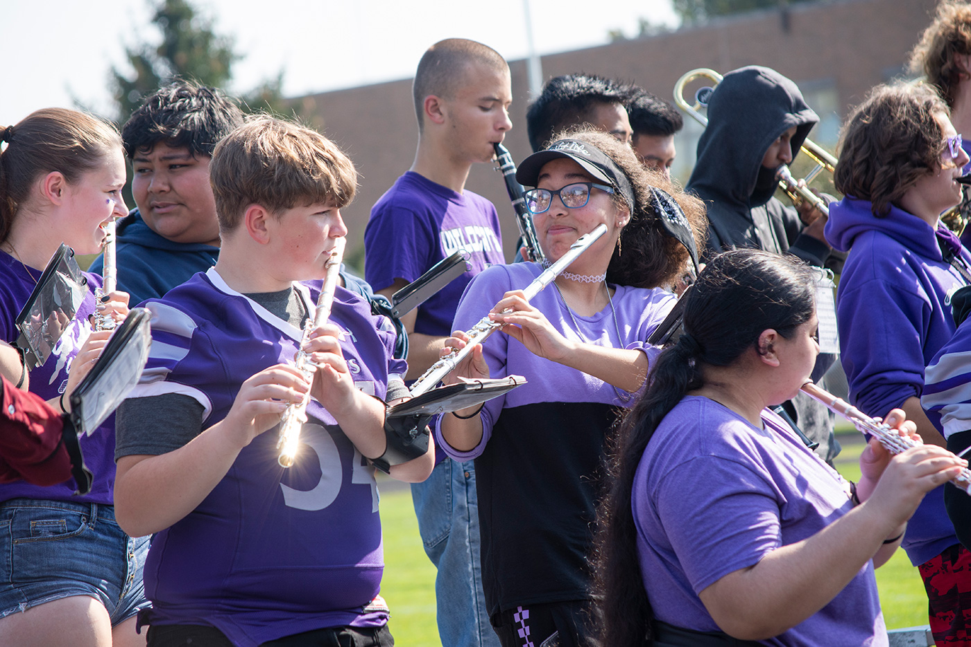 Green Bay West High School Band members playing outside.