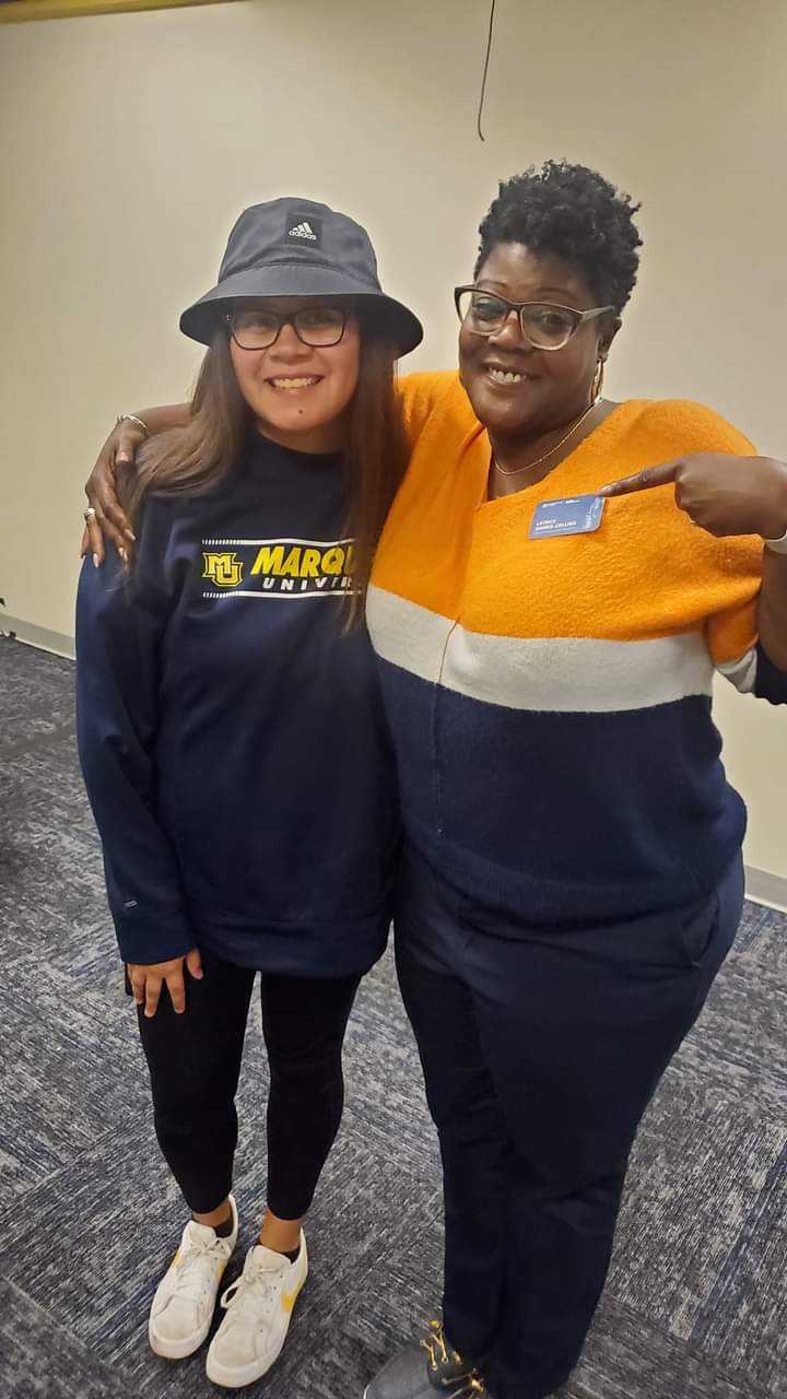 Latrice Harris-Collins with a student during Marquette University tour.