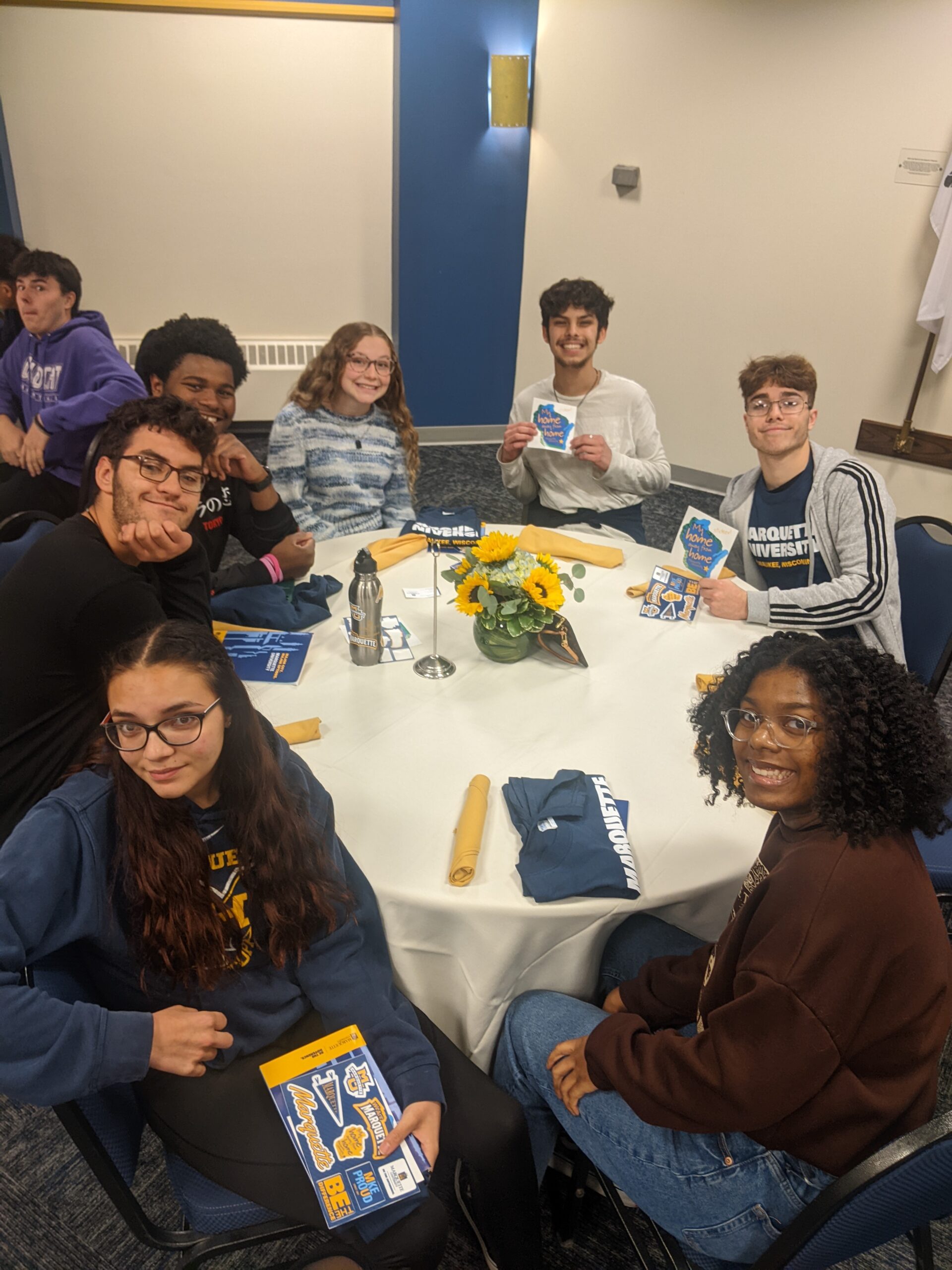 Students with Marquette University merch during fall tour.