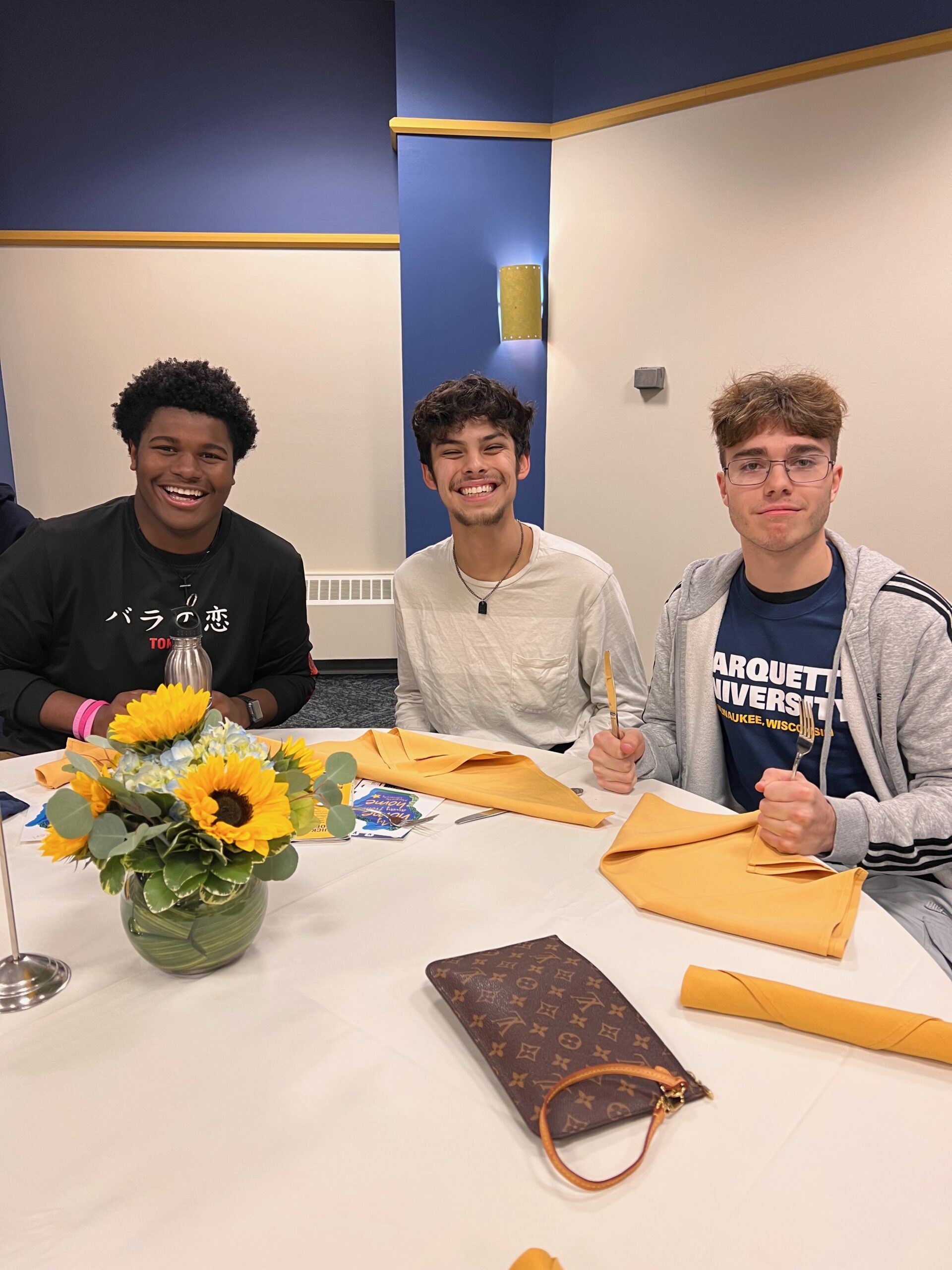 Three DGT students at lunch during Marquette University tour.