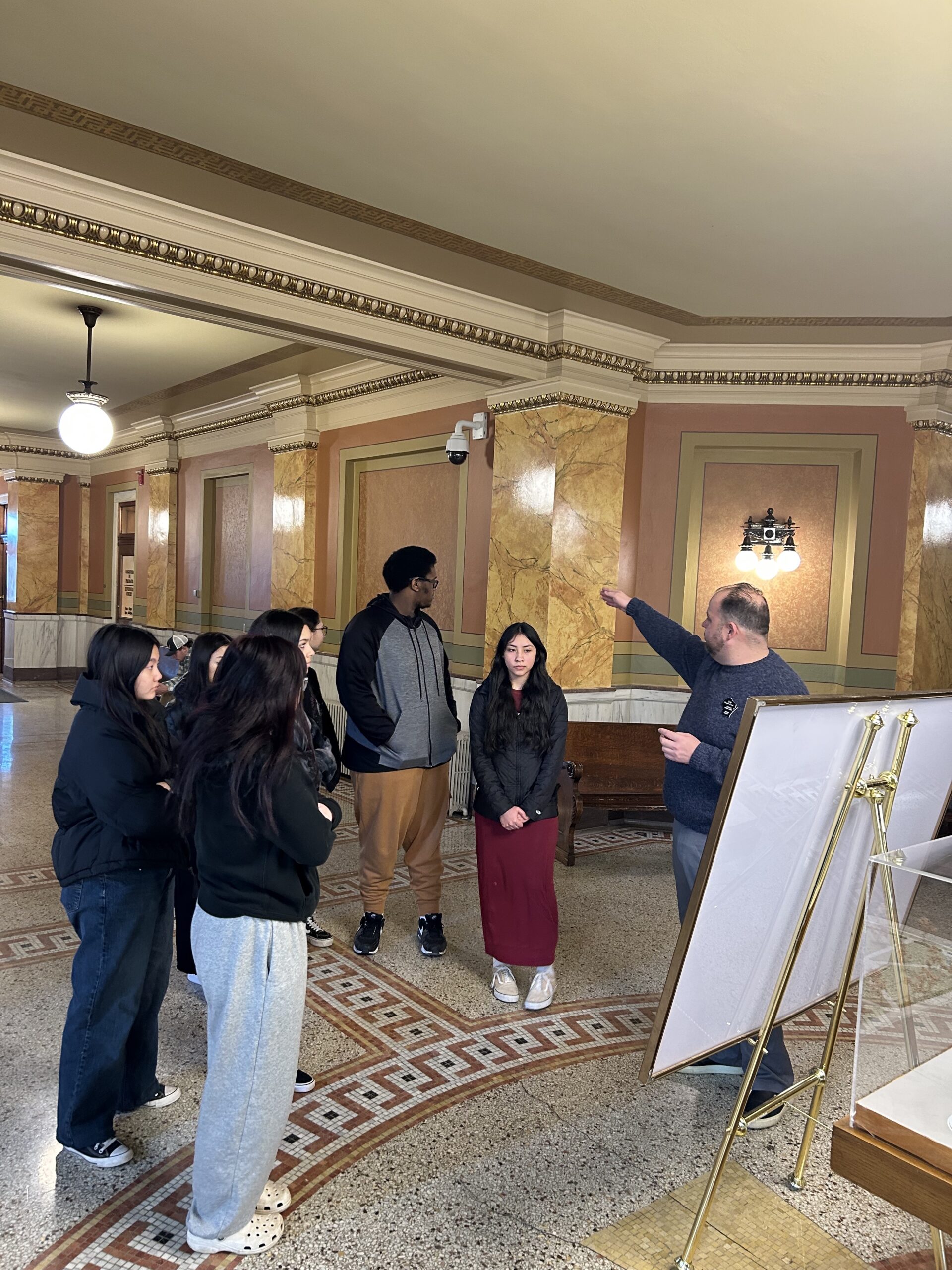 Green Bay West students tour the lobby of the Brown County Courthouse.