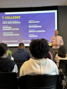 Students listen to admissions counselors at Marquette University. 