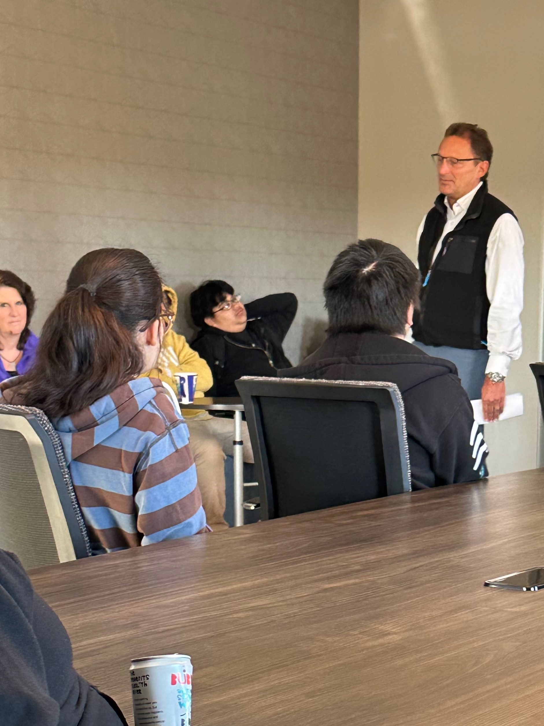 Brian Krenke, CEO of KI Furniture talks to students from Green Bay West High School.