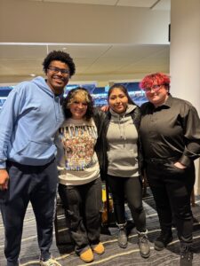 Students attend a Marquette University basketball game.