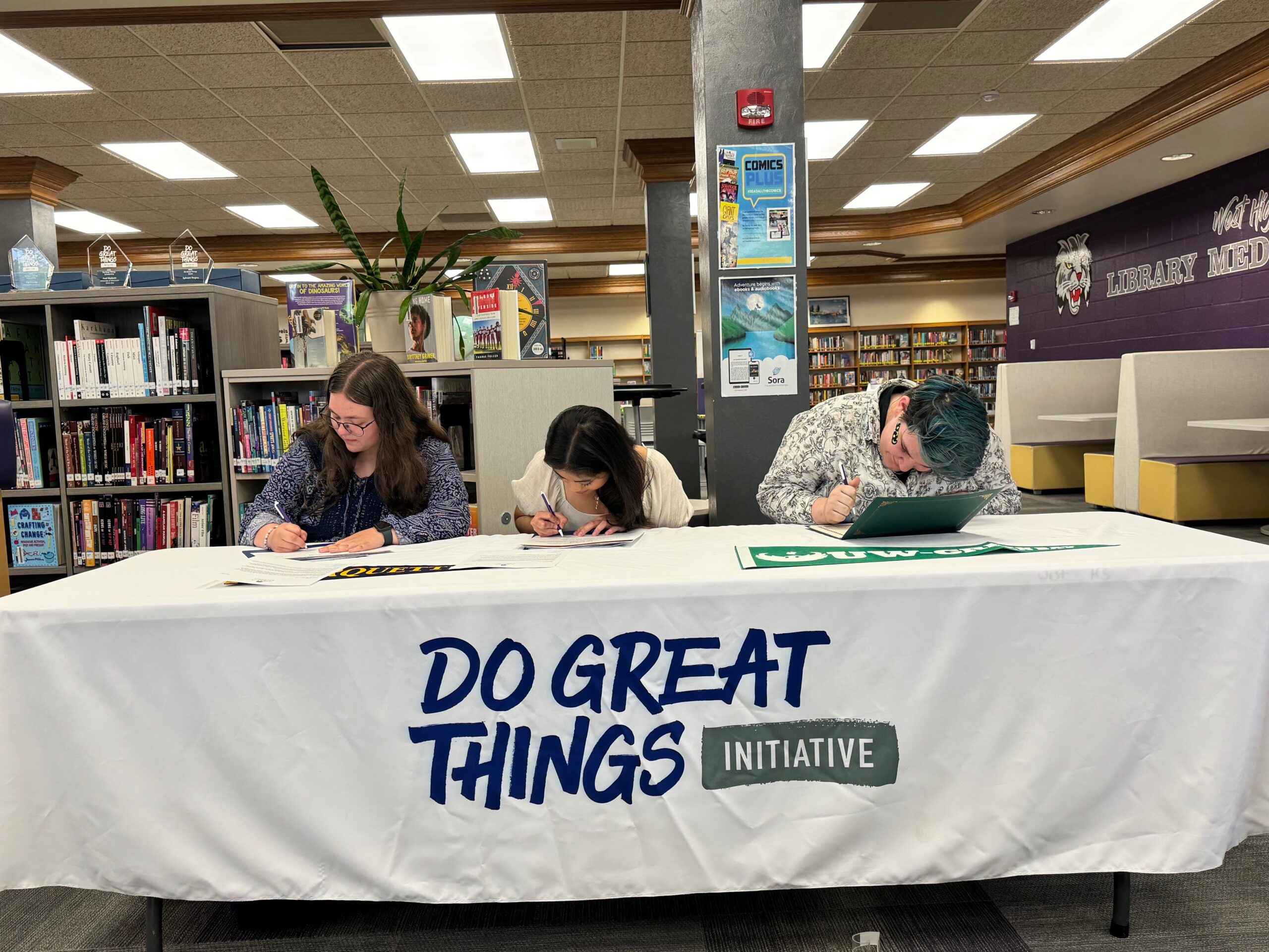 Scholarship recipients sign letters of intent.